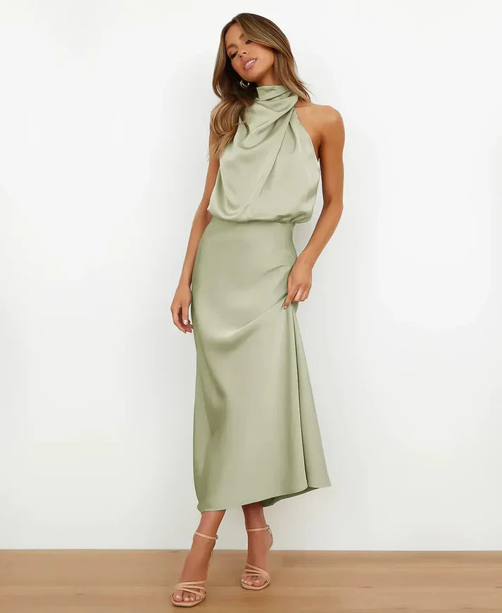 Sage green satin halter maxi dress with a draped blouson bodice and floor-length skirt.