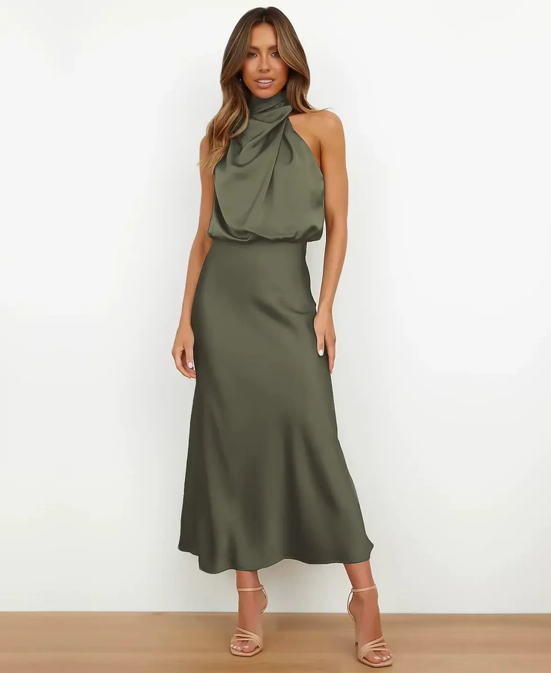 Olive green satin halter maxi dress featuring a draped blouson bodice and a floor-length, flowing silhouette.