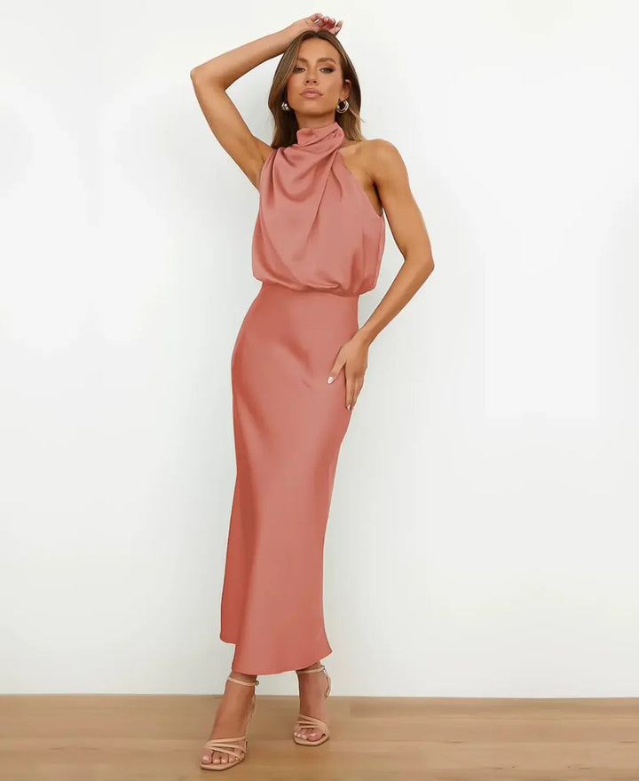 Dusty rose satin maxi dress featuring a draped high halter neckline and a sleeveless blouson bodice.