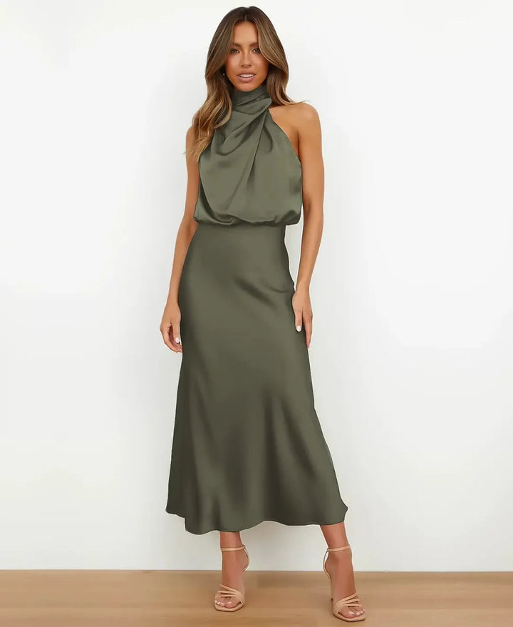 Olive green satin maxi dress featuring a draped halter neckline, blouson bodice, and a sleek floor-length skirt.