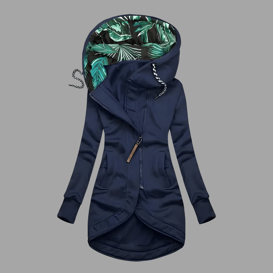 Navy blue longline hooded parka with an asymmetric zip and green tropical-print lining.