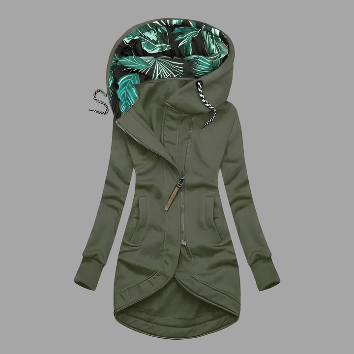 Olive green longline hooded parka with an asymmetric zip, front pockets, and a tropical leaf-print lining.