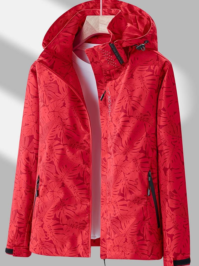 Red waterproof hooded jacket featuring a tropical leaf print, full-length zip, and adjustable toggles.