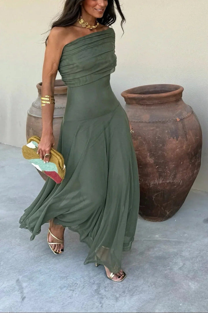 Olive green one-shoulder maxi dress with a pleated bodice and fluid, lightweight skirt for a feminine silhouette.