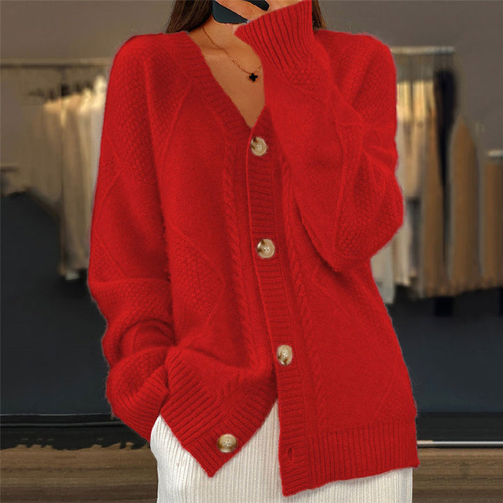 Red wool cable knit cardigan with a V-neck, button-up front, and textured diamond-pattern weave.