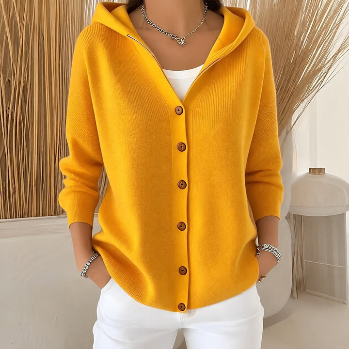 Mustard yellow hooded cardigan in soft knit with wooden-effect buttons and a relaxed, comfortable fit.