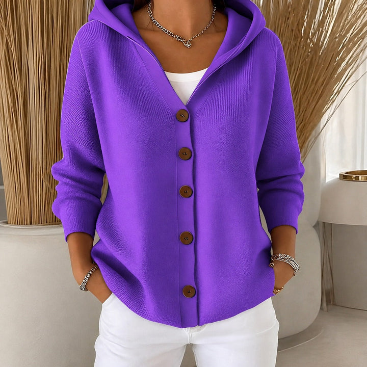 Vibrant purple knitted hooded cardigan with a button-up front and relaxed fit, perfect for cosy, casual layering.