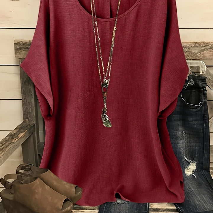 Burgundy linen-look round neck top with relaxed batwing sleeves and a loose, draped silhouette.