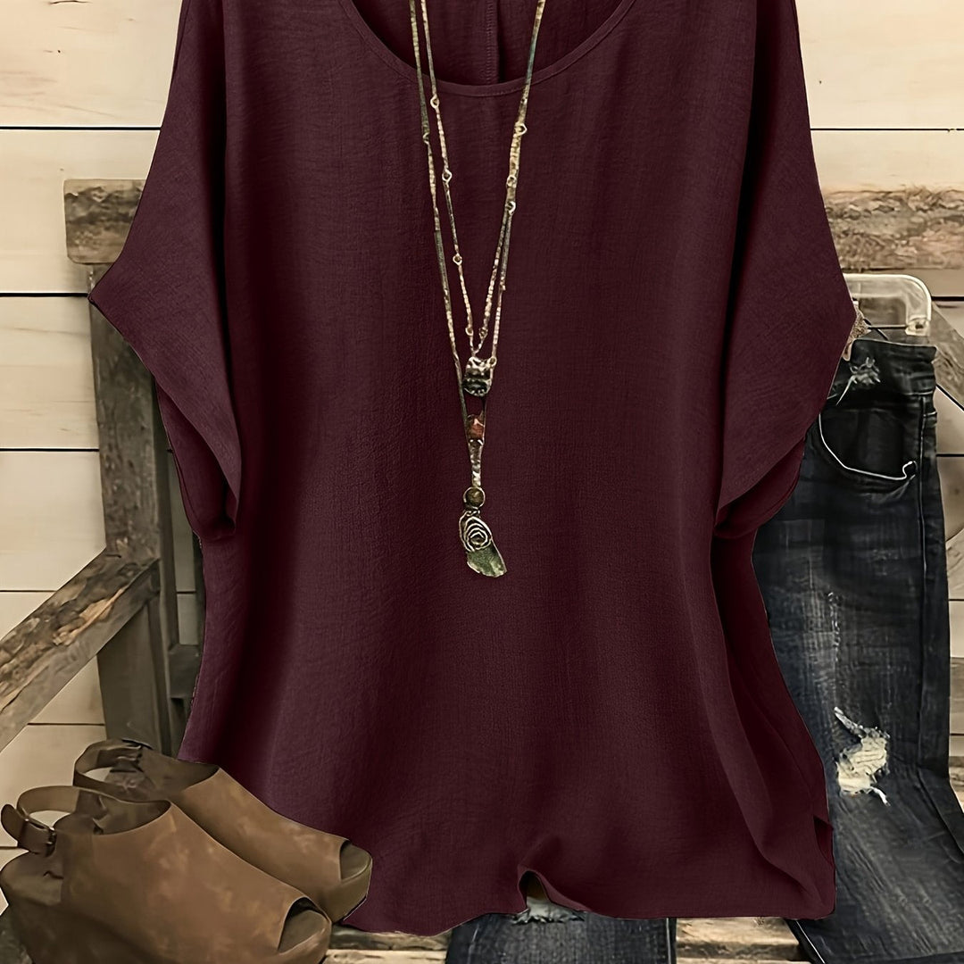 Burgundy linen-look top with a round neck, batwing sleeves, and a relaxed, loose-fitting silhouette.
