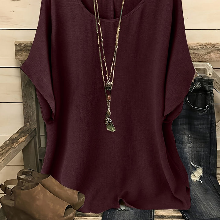 Burgundy linen-look top with a round neck, batwing sleeves, and a relaxed, loose-fitting silhouette.