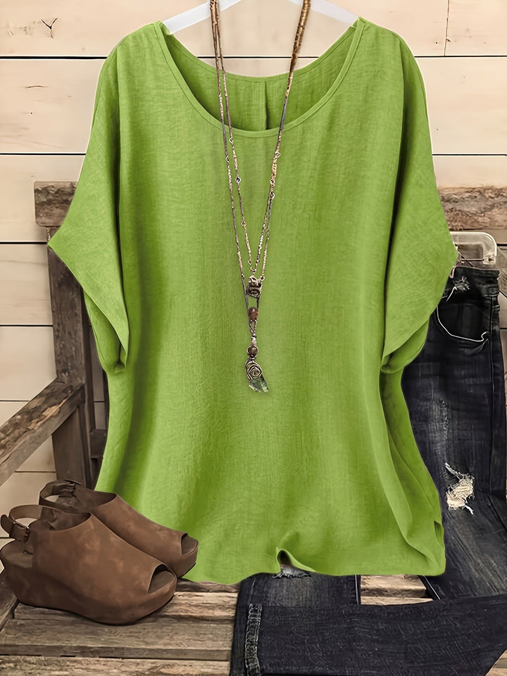 Lime green linen-look round neck top with batwing sleeves and a relaxed, airy silhouette.