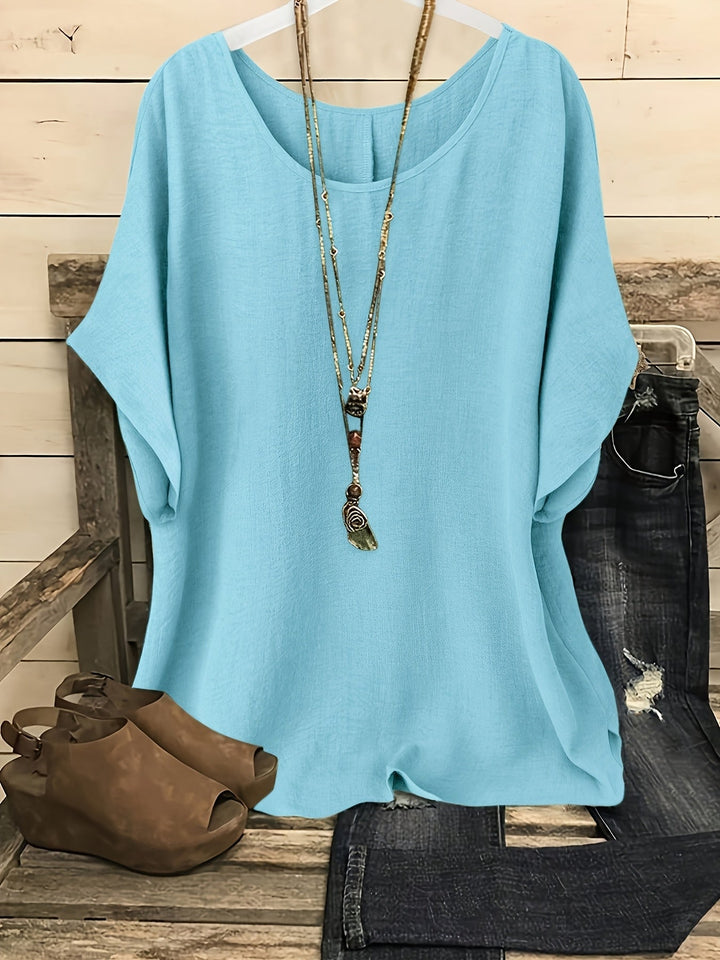 Light blue linen-look round neck top with batwing sleeves and a relaxed, airy silhouette.