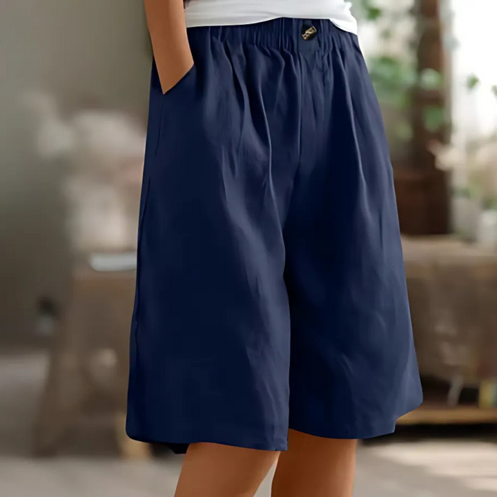 Maisie women's navy elastic waist Bermuda shorts with pockets, perfect for relaxed sunny-day styling.