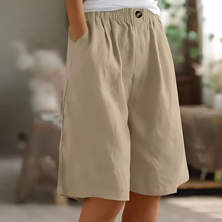 Maisie women's beige elastic waist Bermuda shorts with pockets, perfect for relaxed sunny-day styling.