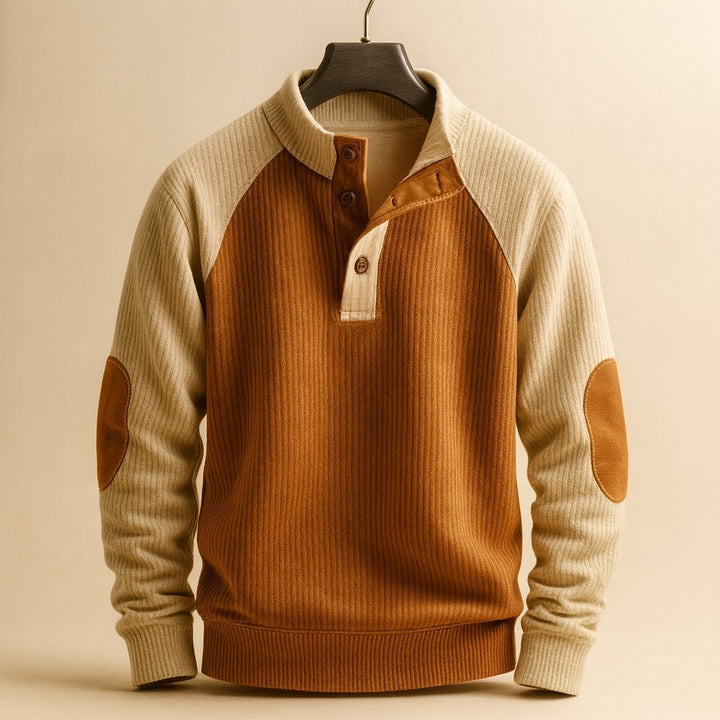 Men's ribbed knit jumper in tan and brown with a button-neck placket, raglan sleeves, and reinforced elbow patches.