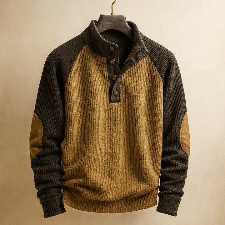 Tan and charcoal ribbed knit jumper with raglan sleeves, button-neck placket, and reinforced elbow patches.