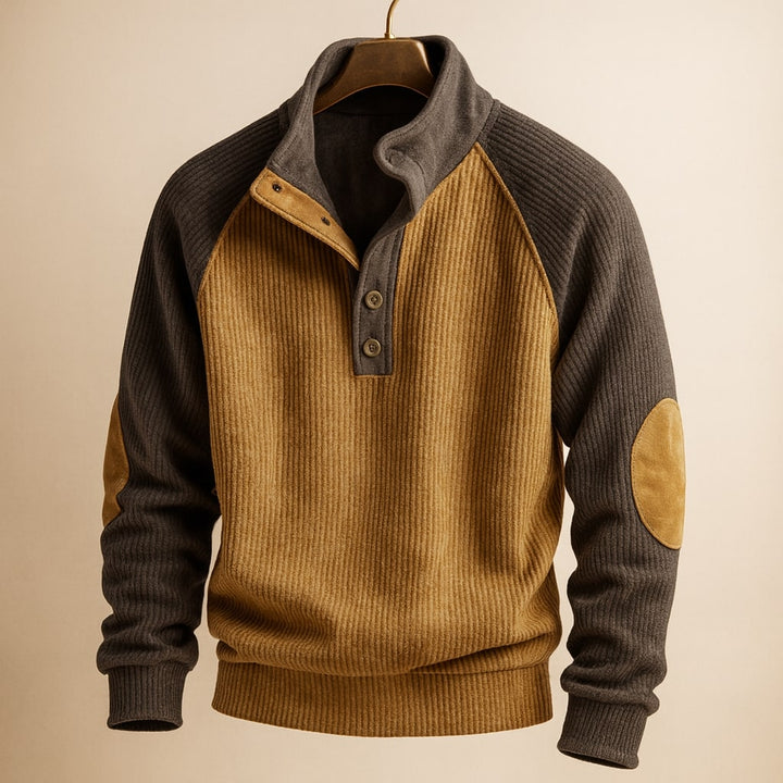 Brown and charcoal ribbed knit jumper with raglan sleeves, button-neck placket, and tan elbow patches.