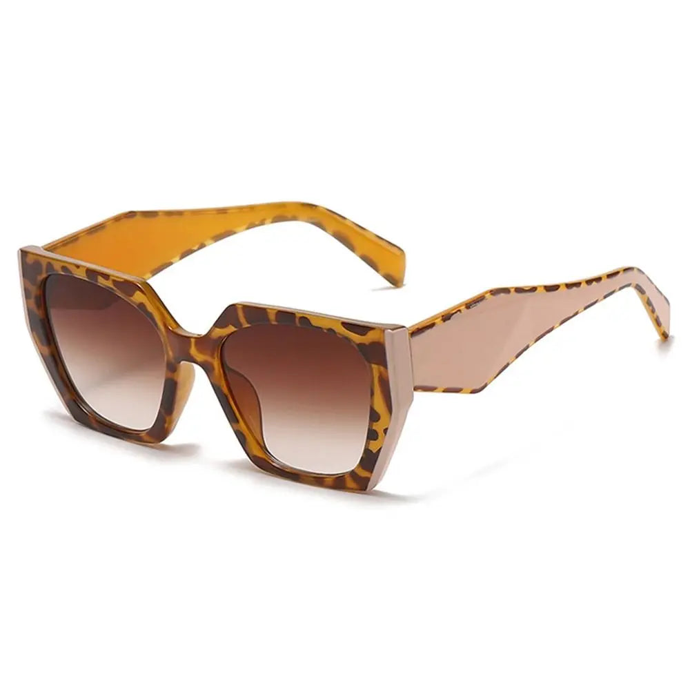 Margot oversized square sunglasses with a bold leopard print frame and polished brown gradient lenses.
