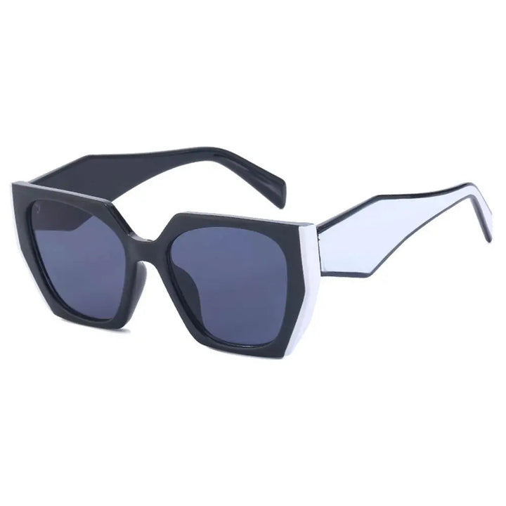 Margot women's oversized square sunglasses with bold black frames, white angular detailing, and dark gradient lenses.