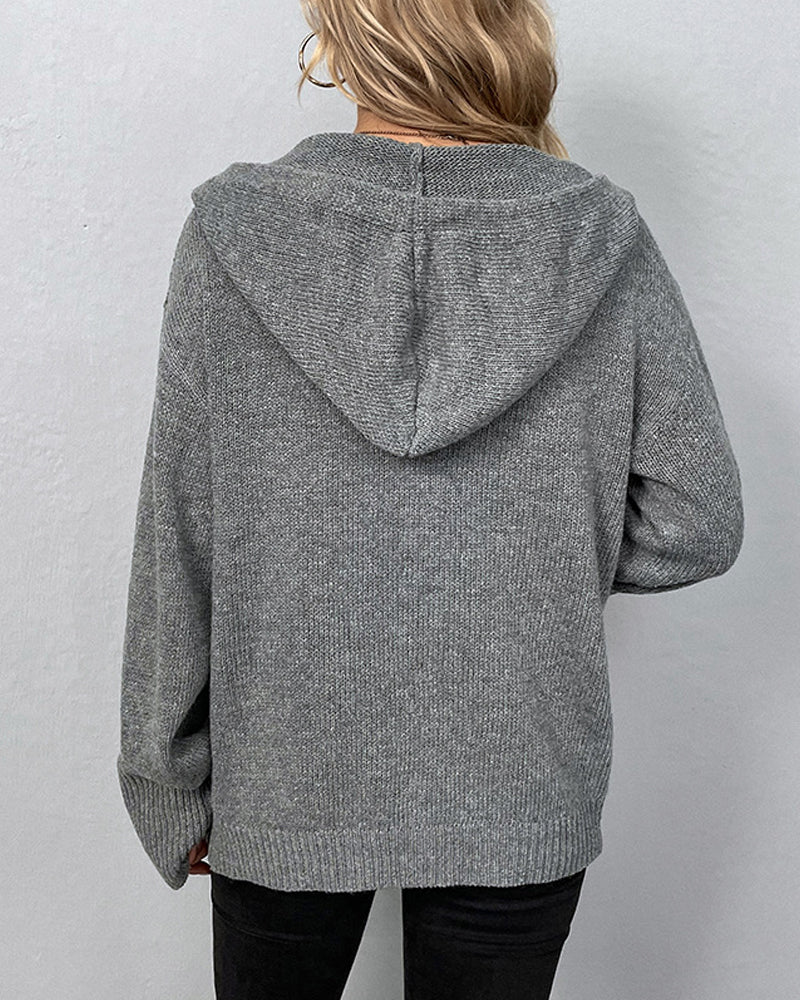 Back view of a cozy grey hooded knit cardigan with ribbed cuffs and a relaxed, comfortable fit.
