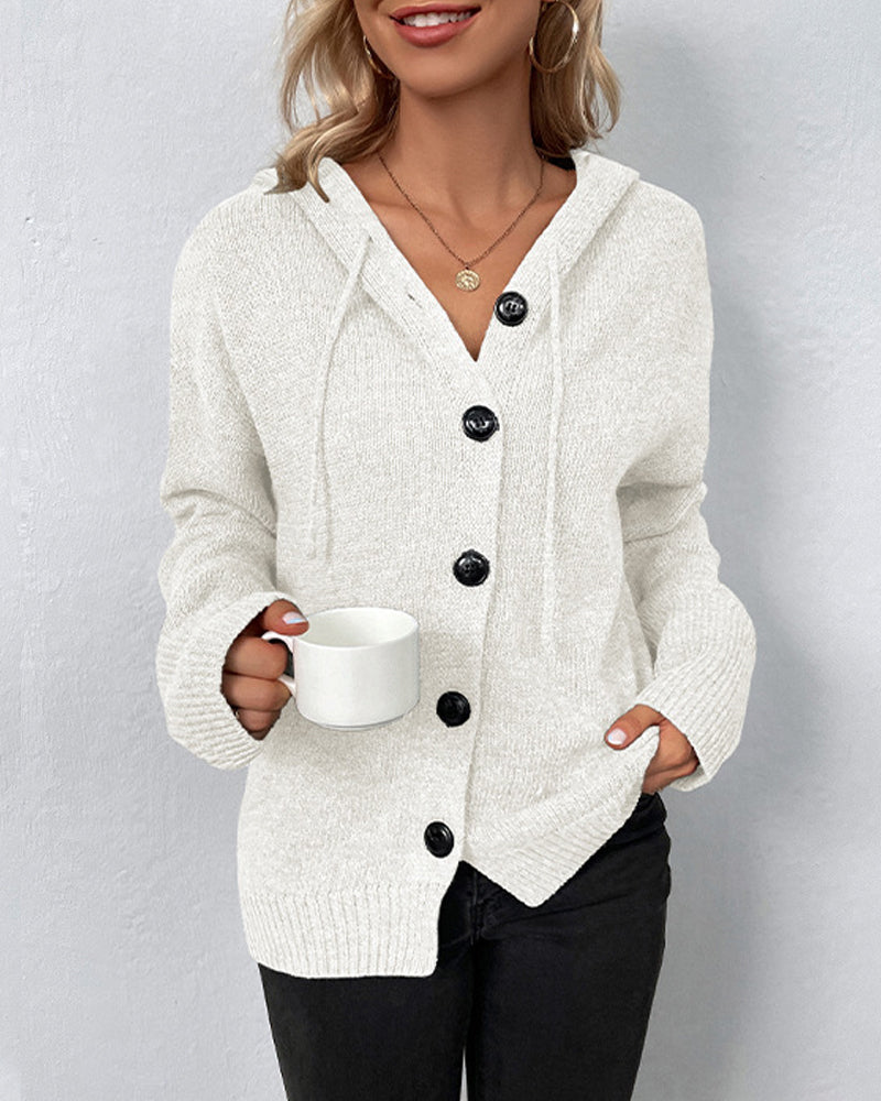 Cream hooded knit cardigan with a button-front closure, drawstring detail, and ribbed cuffs for a cozy, relaxed fit.