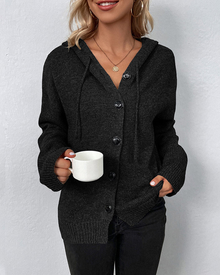 Black hooded knit cardigan with a button-front closure, drawstring detail, and ribbed cuffs for a cozy, relaxed fit.
