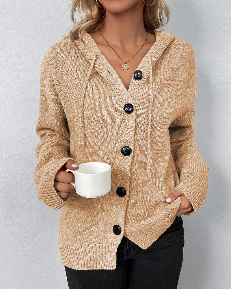 Cozy tan knit cardigan featuring a relaxed hood, drawstring detail, and a stylish button-front closure for easy layering.