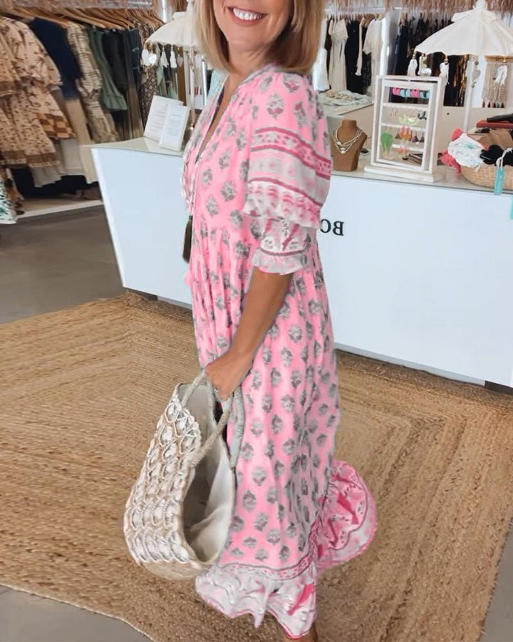 Matilda floral V-neck maxi dress in pink with a graceful, body-skimming drape and fluid fabric.