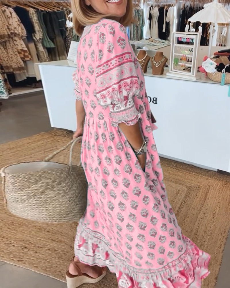 Matilda floral V-neck maxi dress in pink with a graceful, body-skimming drape and fluid fabric.