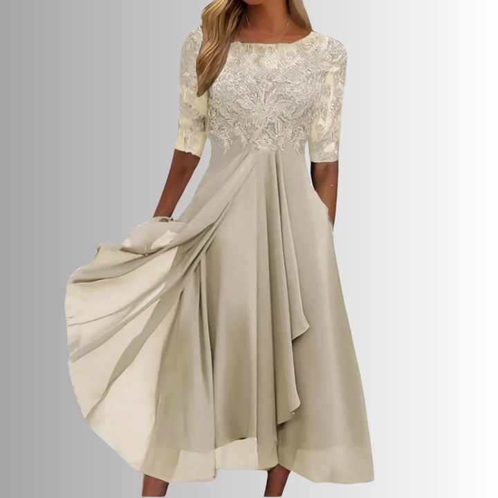 Matilda women's lace maxi dress in champagne, featuring a delicate lace top and flowing layered skirt.