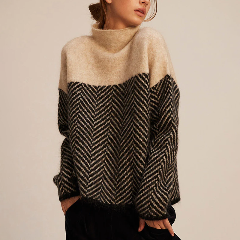 Oversized high-neck jumper in a soft, two-tone beige and black herringbone knit pattern with a relaxed fit.