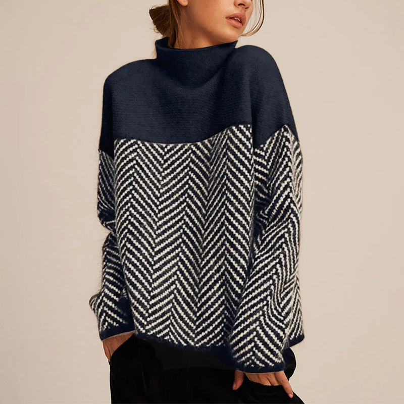 Oversized high-neck jumper in navy and white with a two-tone herringbone knit pattern and relaxed fit.