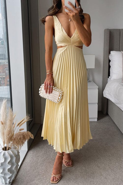 Pale yellow satin midi dress with a V-neckline, waist cut-outs, and a finely pleated skirt.