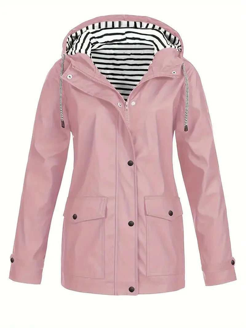 Dusty pink waterproof rain jacket featuring a black and white striped hood lining, snap-down storm flap, and front pockets.
