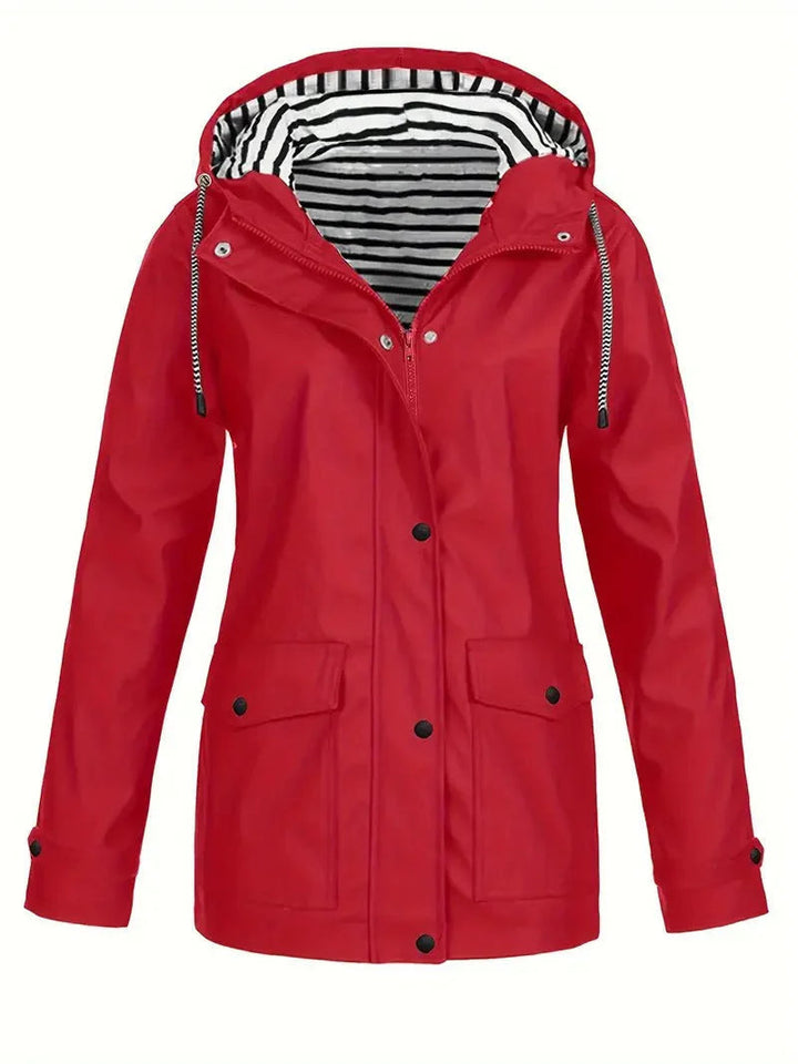 Red waterproof hooded rain jacket featuring a black and white striped lining, snap-down storm flap, and front pockets.