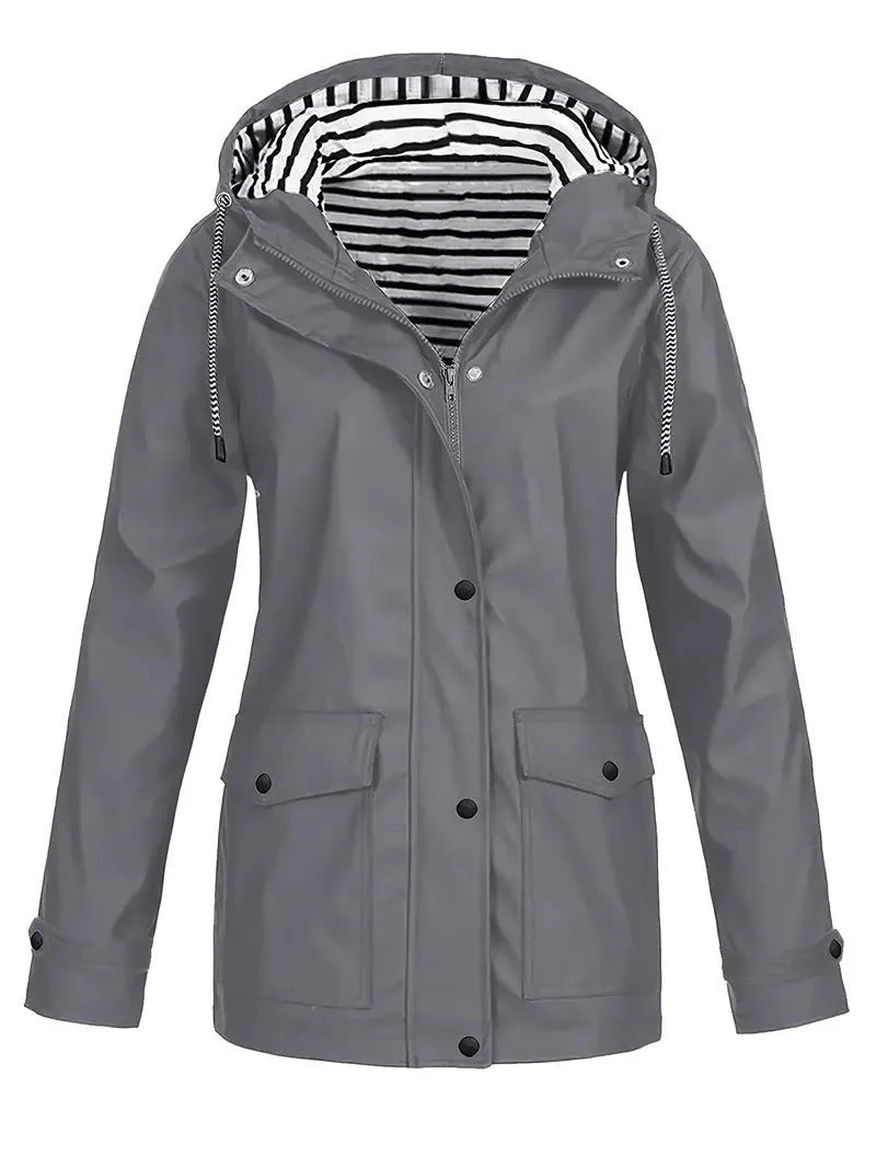 Grey waterproof rain jacket featuring a drawstring hood, snap-down storm flap, and a stylish black and white striped lining.