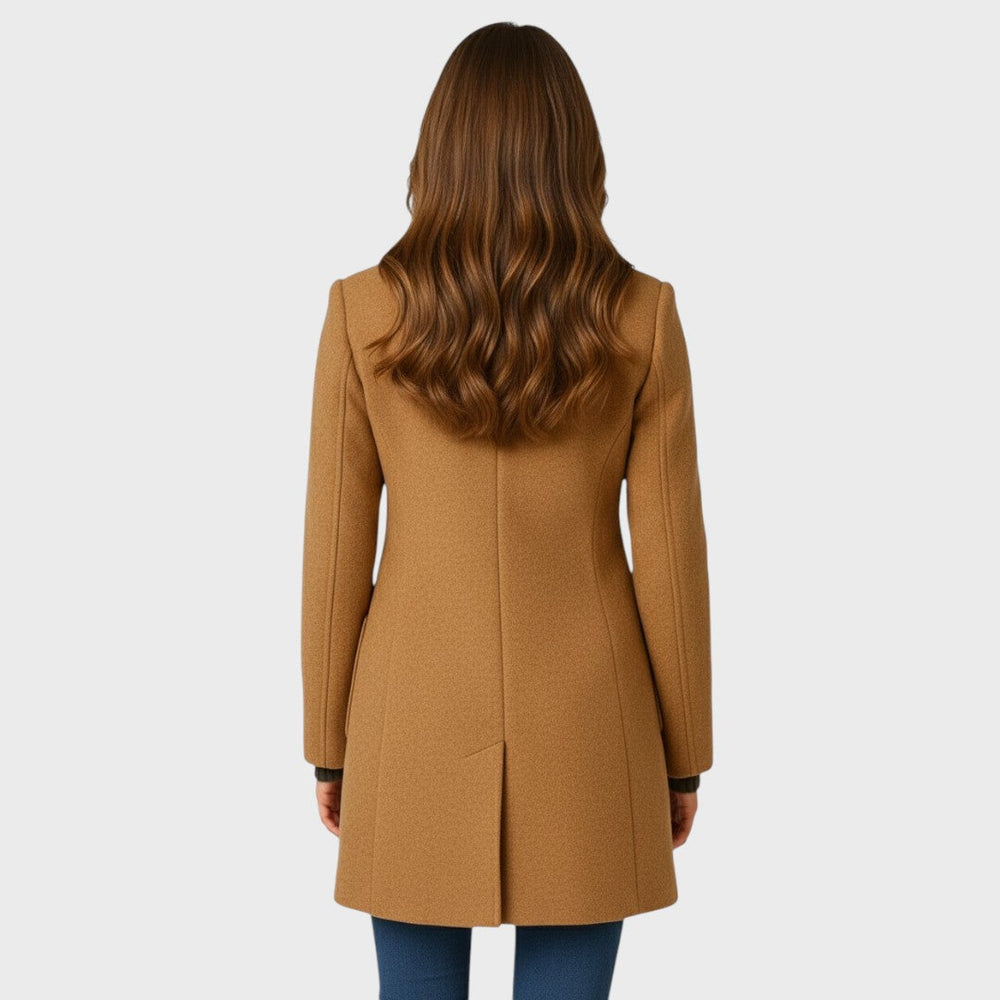 Back view of a camel-colored tailored mid-length coat with a sleek, structured silhouette and a clean center back vent.