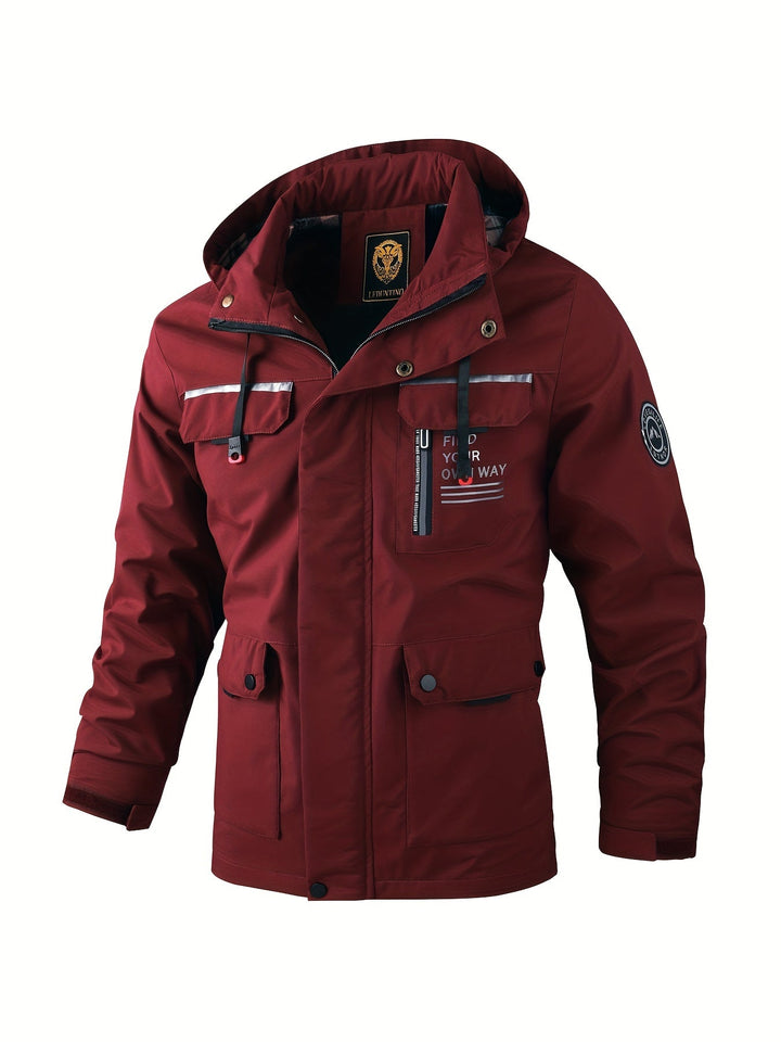 Burgundy men's hooded utility jacket with a full-zip storm placket, multiple flap pockets, and reflective detailing.