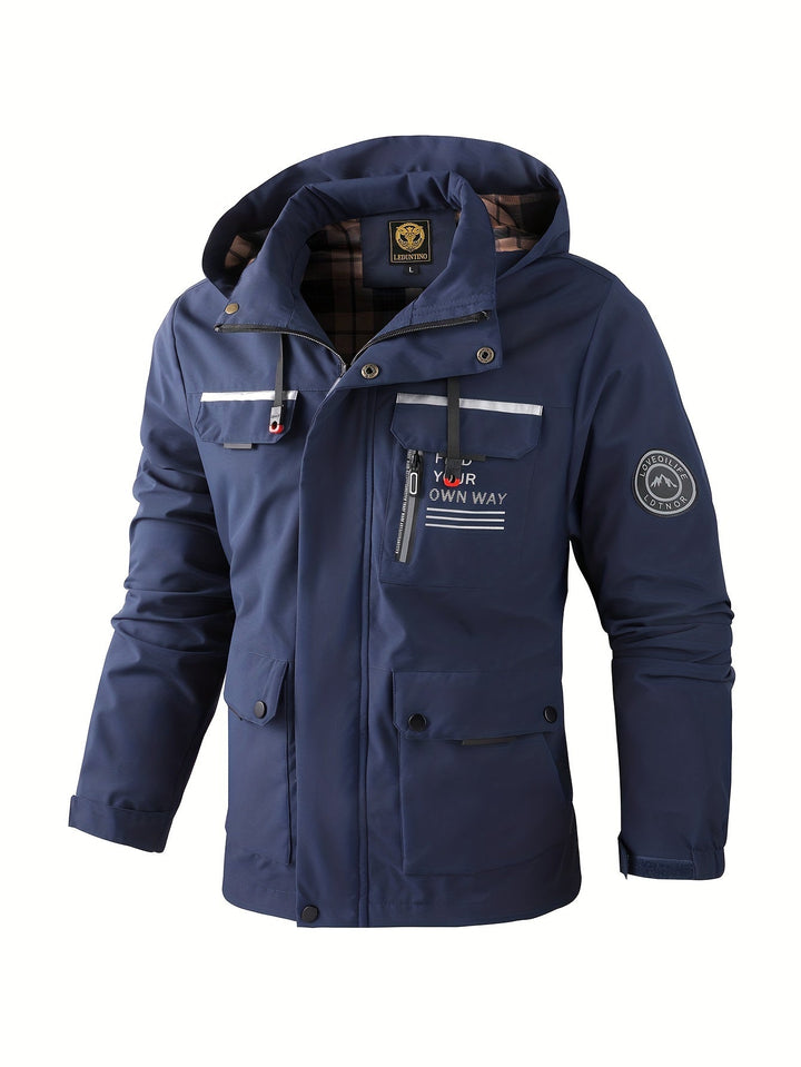Navy blue men's hooded utility jacket with multiple pockets, zip closure, and plaid lining for cold-weather protection.