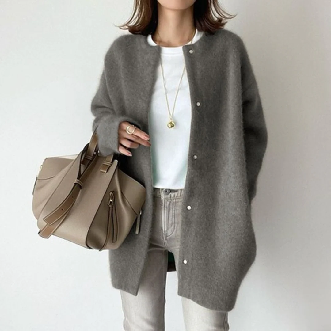 Oversized charcoal grey knit cardigan with a round neckline and button-up front, styled for a cozy, relaxed fit.