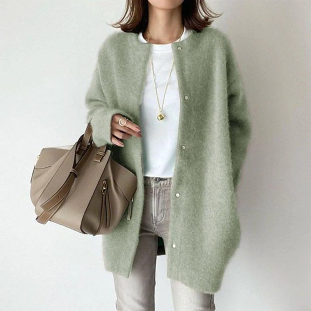 Sage green oversized knit cardigan with a round neckline, full button-up front, and soft, cozy texture.