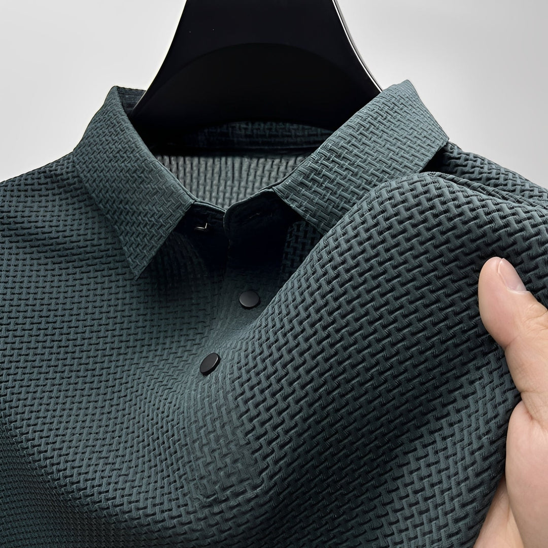 Dark green short sleeve polo shirt with a waffle-weave texture, spread collar, and two-button placket.