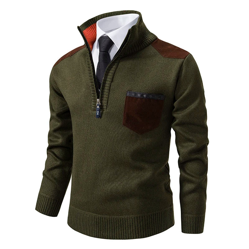 Olive green quarter-zip knit jumper with brown shoulder and chest pocket patches, featuring a ribbed funnel neck.