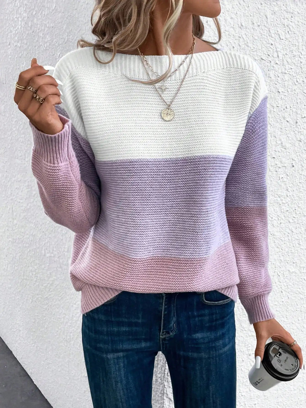 Women's colourblock knit jumper featuring horizontal white, lavender, and pink panels with a wide ribbed neckline.
