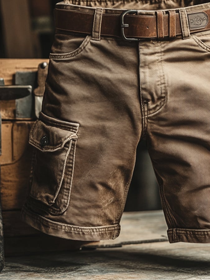 Rugged brown knee-length cargo shorts with side pockets and a leather belt, featuring a durable, worn-in fabric finish.