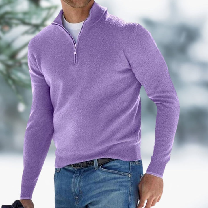 Men's slim-fit purple quarter-zip knit sweater with a stand collar, worn over a white tee and blue jeans.