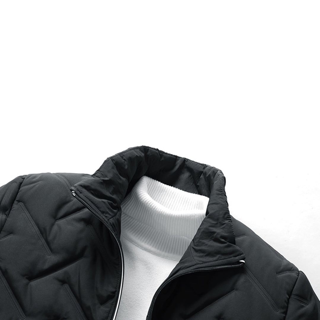 Black quilted chevron padded jacket with a stand-up collar layered over a white ribbed turtleneck sweater.