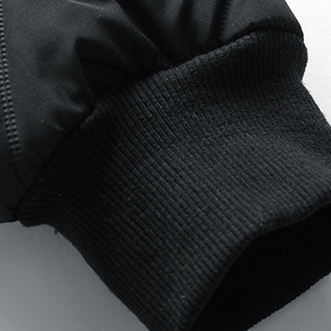 Black quilted Oliver jacket sleeve featuring a snug ribbed cuff and chevron padded detailing.
