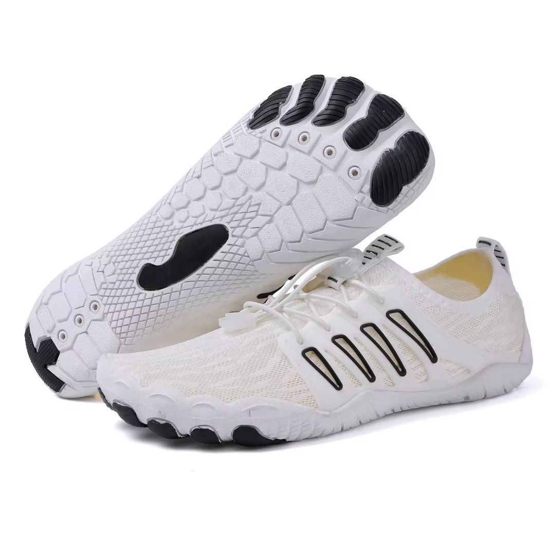 White lightweight barefoot walking shoes with breathable mesh, bungee laces, and a flexible, textured black and white sole.