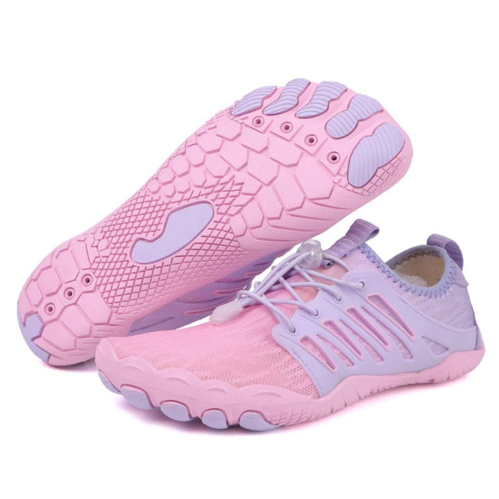 Light pink and lavender barefoot walking shoes featuring a breathable mesh upper, wide toe box, and flexible rubber sole.
